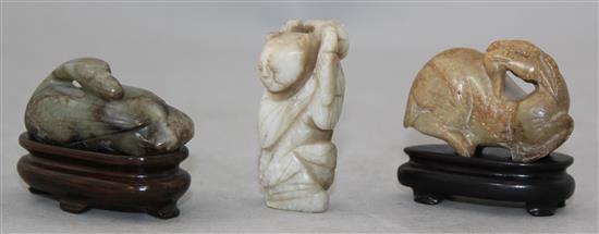 Two Chinese jade figures and a soapstone figure of a recumbent ram,